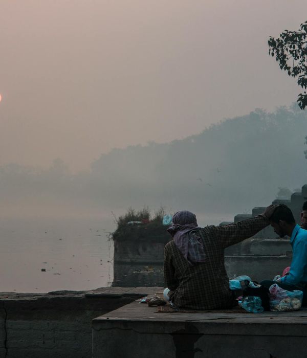 A serene person meditating in a calm environment with golden light.